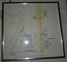 Ancien dessin d’architecte encadré d’un composant de la salle des machines d’un navire