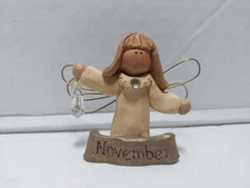 Suzi Skoglund Signed Blossom Bucket Angel Figurine November
