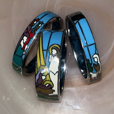 Stained glass style cuff bracelet depicting a...