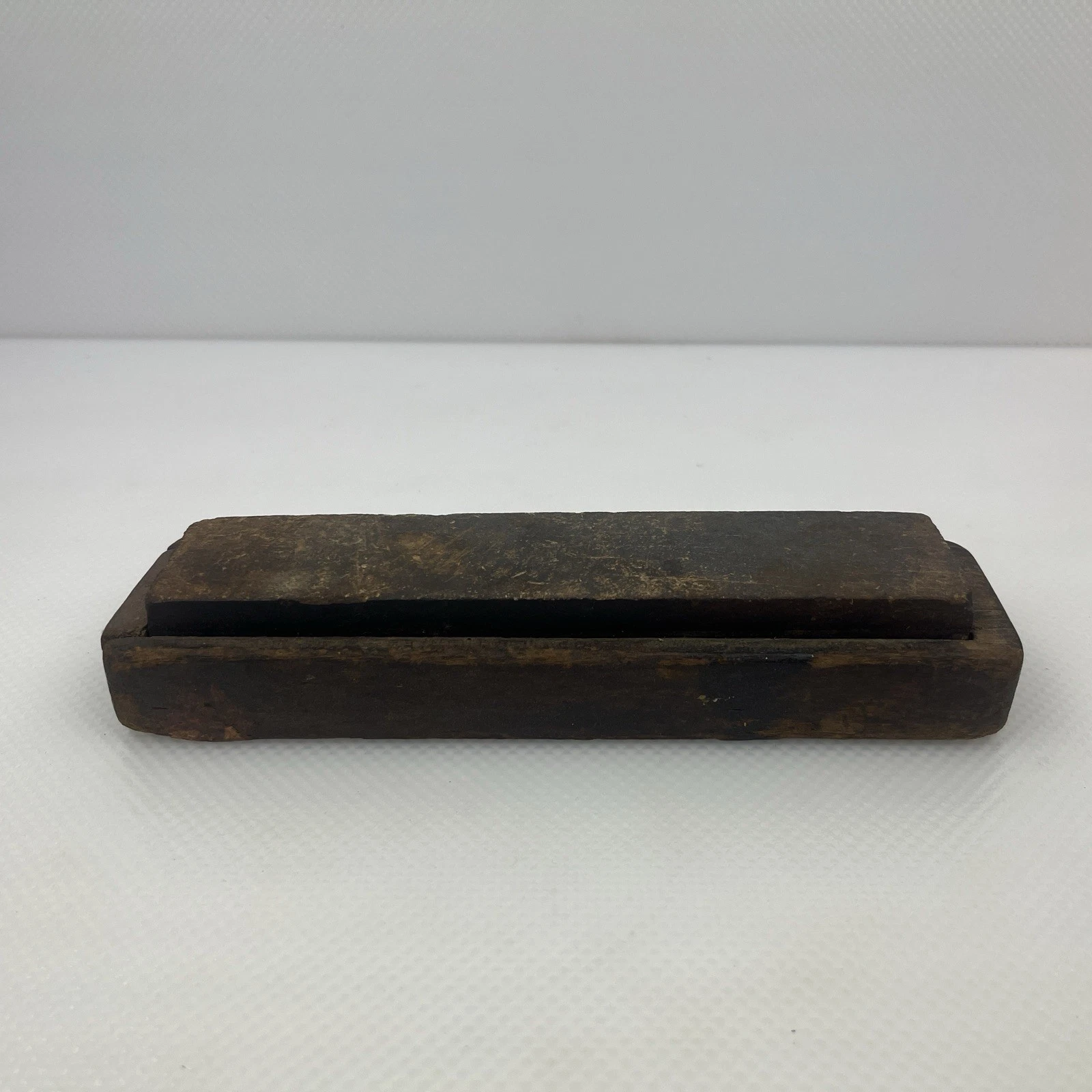 Antique Primitive Sharpening Stone Set In Wood