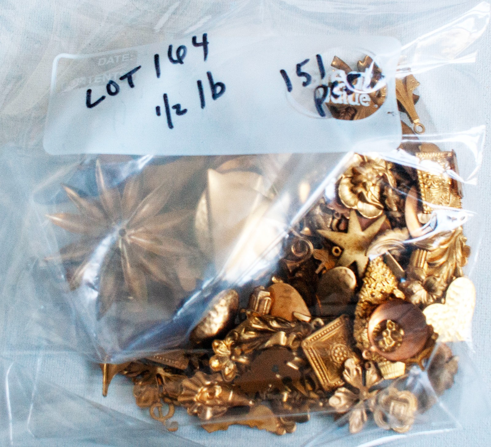 Lot 164  1/2 lb (151 pcs) VINTAGE BRASS STAMPINGS, Prowling Leopard