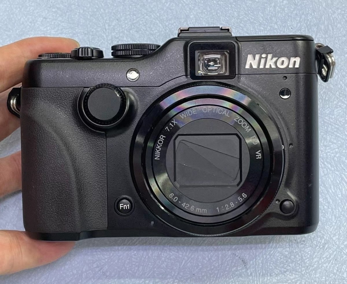 Nikon COOLPIXS COOLPIX P7100 Black Digital Camera used with