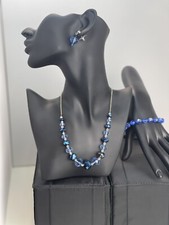 set necklace bracelet and earrings made of blue glass beads. Handmade