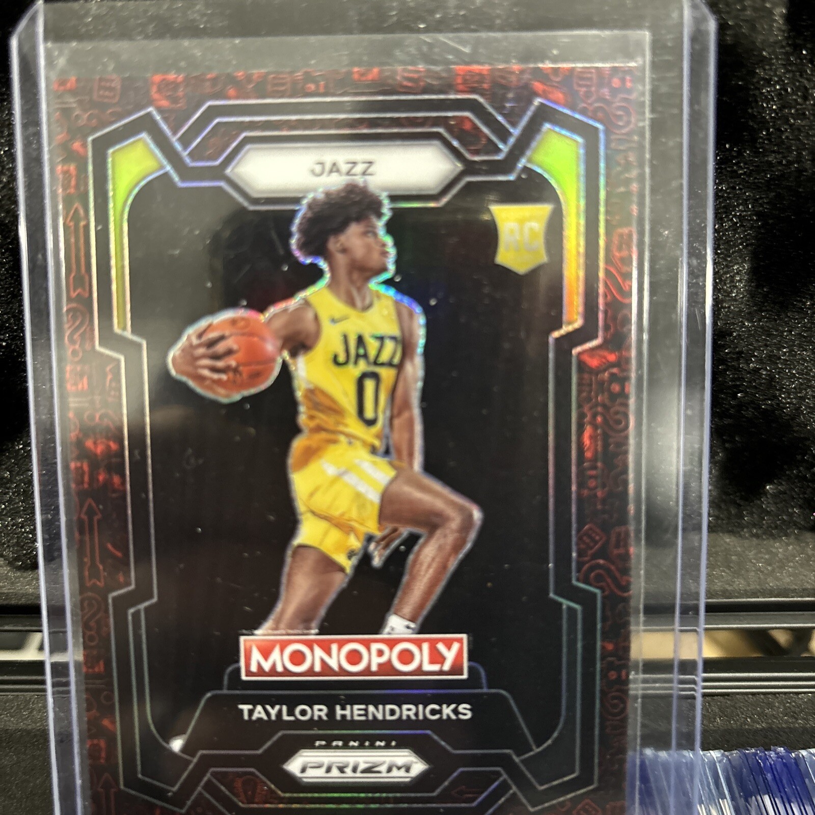 2023-24 PANINI PRIZM MONOPOLY #86 TAYLOR HENDRICKS ROOKIE RED PATTERN PRIZM RC