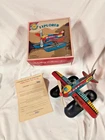VINTAGE SCHYLLING EXPLORER PLANE TIN TOY WIND UP