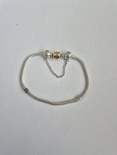 Genuine Silver Pandora Bracelet With 14KT Gold Clasp and  safety chain 19cm