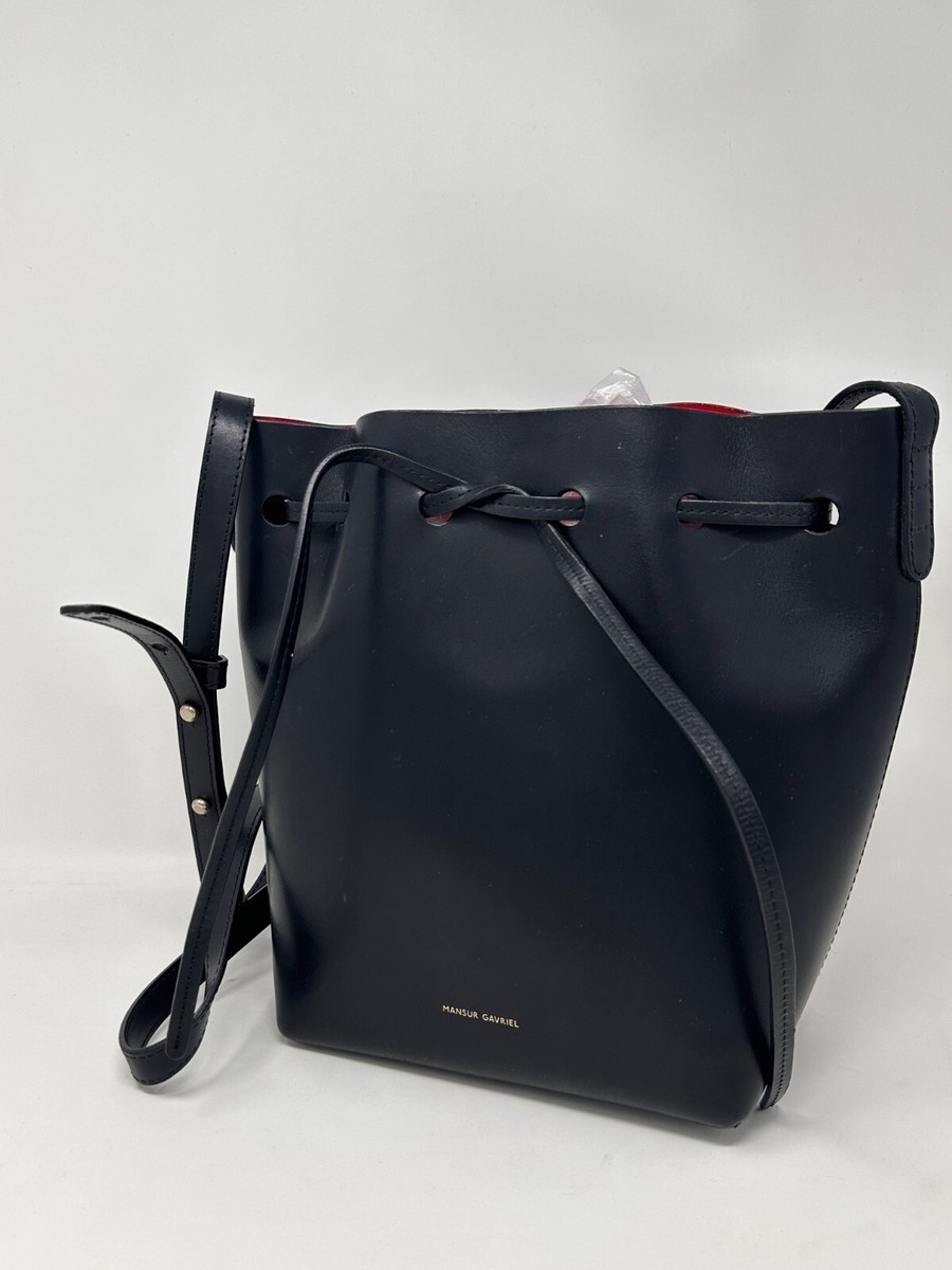 Mansur Gavriel black bucket bag smooth leather red interior ($695