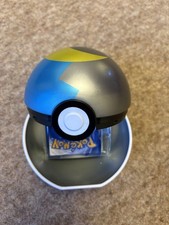 Pok&eacute;mon TCG Moon Ball Tin (opened) With Kids Surprise Pack