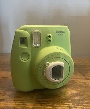 Green Polaroid instax camera
