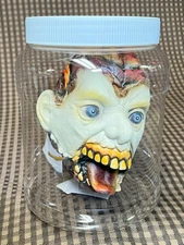 7.5" Rubber Severed Shrunken Zombie Head Plastic Jar Horror Prop Halloween Scary