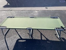 Green Convert Foldable Cot 72  X 15  X 24.5  - Pre Owned 300 lbs.