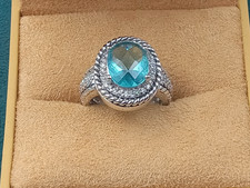 Sterling Silver Ring w. Blue Topaz Oval Center Stone  Clear Trim Stones: Size 6