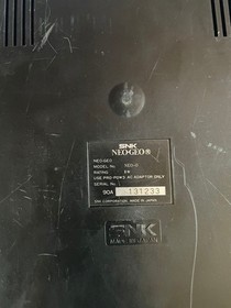 Neo Geo console, 2 controllers, 5 ROM cartridges, and 1 memory card.Tested 