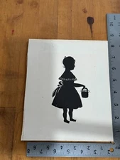 Silhouette of Girl in Dress W/ Basket of Flowers