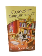 Curiosity Thrilled the Cat Sofie Kelly Magical Cats Mystery PAPERBACK BOOK 2011