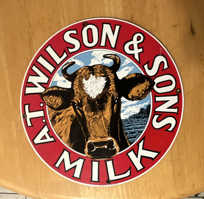 A.T. Wilson & Sons Milk Metal Round Advertising Sign Plaque Cow Graphic 1994