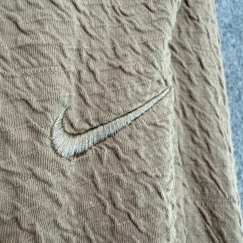 Pantalones de chándal Nike Yoga texturizados para hombre medianos cónicos Dri Fit caqui marrón elástico Foto 3 de 4