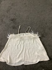 PRETTY IVORY  TOP WITH FEATHERS SIZE SMALL BY ZARA 