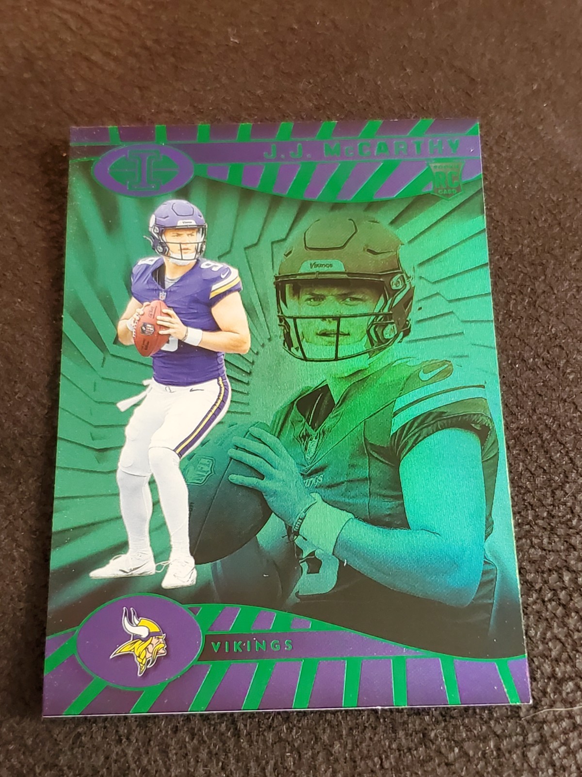 2024 Panini Illusions #100 JJ McCarthy Rookie Emerald Trophy Collection