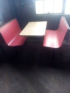 plymold self edge booth red seat tan table. Bolts to floor for safety assurance.