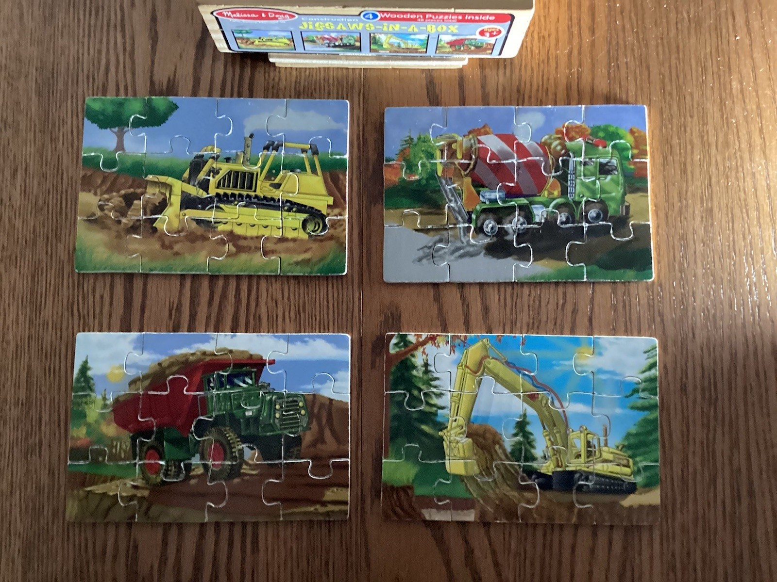 4 Wooden Puzzles in a Box by Melissa and Doug - 4 boxes = 16 puzzles.  Pre owned