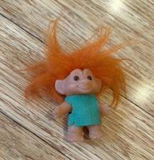 Vintage DAM Troll Doll amber eyes Orange hair Green Dress. 3" DAM marked On Foot