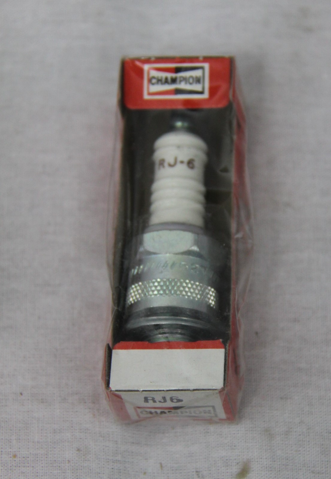 Champion RJ6 Spark Plug. NOS. Selling by the piece.