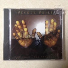 SECRET SMILE - ROAD LESS TRAVELED BRAND NEW CD