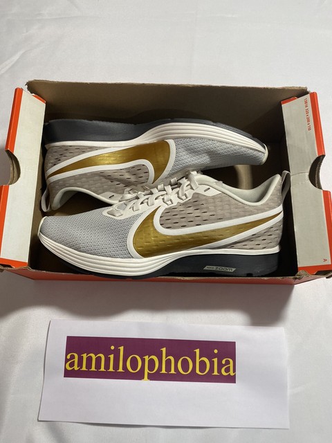 nike zoom strike 2 gold