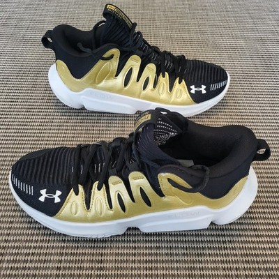 Size 9.5 - Under Armour Flow Breakthru 4 Black Metallic Gold W