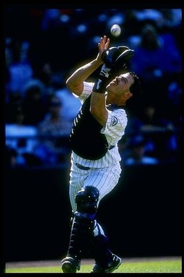 Catcher Jayhawk Owens Colorado Rockies runs to catch a ball at a g- Old Photo