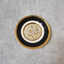 The art of Chokin butterfly and flowers black and gold plate.