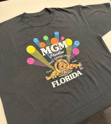 Vintage MGM Studios Florida T-Shirt Black Graphic Lion Logo AS-IS Hole Stain