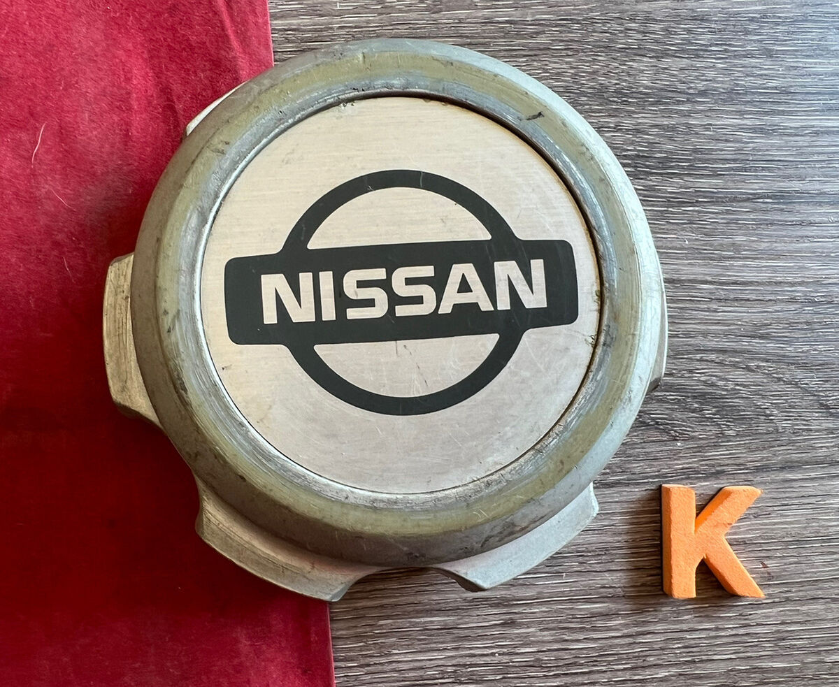K (1) 1996- 1997 Nissan Hardbody alloy wheel center cap K (1) 1996- 1997 Nissan Hardbody alloy wheel center cap