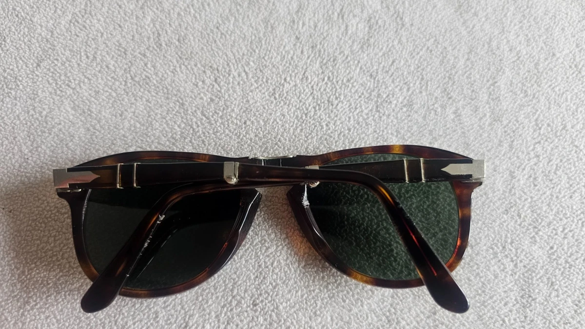 Persol brown frame folding sunglasses. 714.