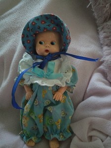 Vintage Celluloid Sleepy Eyed With Bonet.