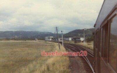 PHOTO  APPROACHING DOVEY JUNCTION STATION TRAIN APPROACHING FROM BARMOUTH.  THE