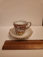 VINTAGE WHITE AND GOLD FOOTED PORCELAIN  CUP & Saucer 