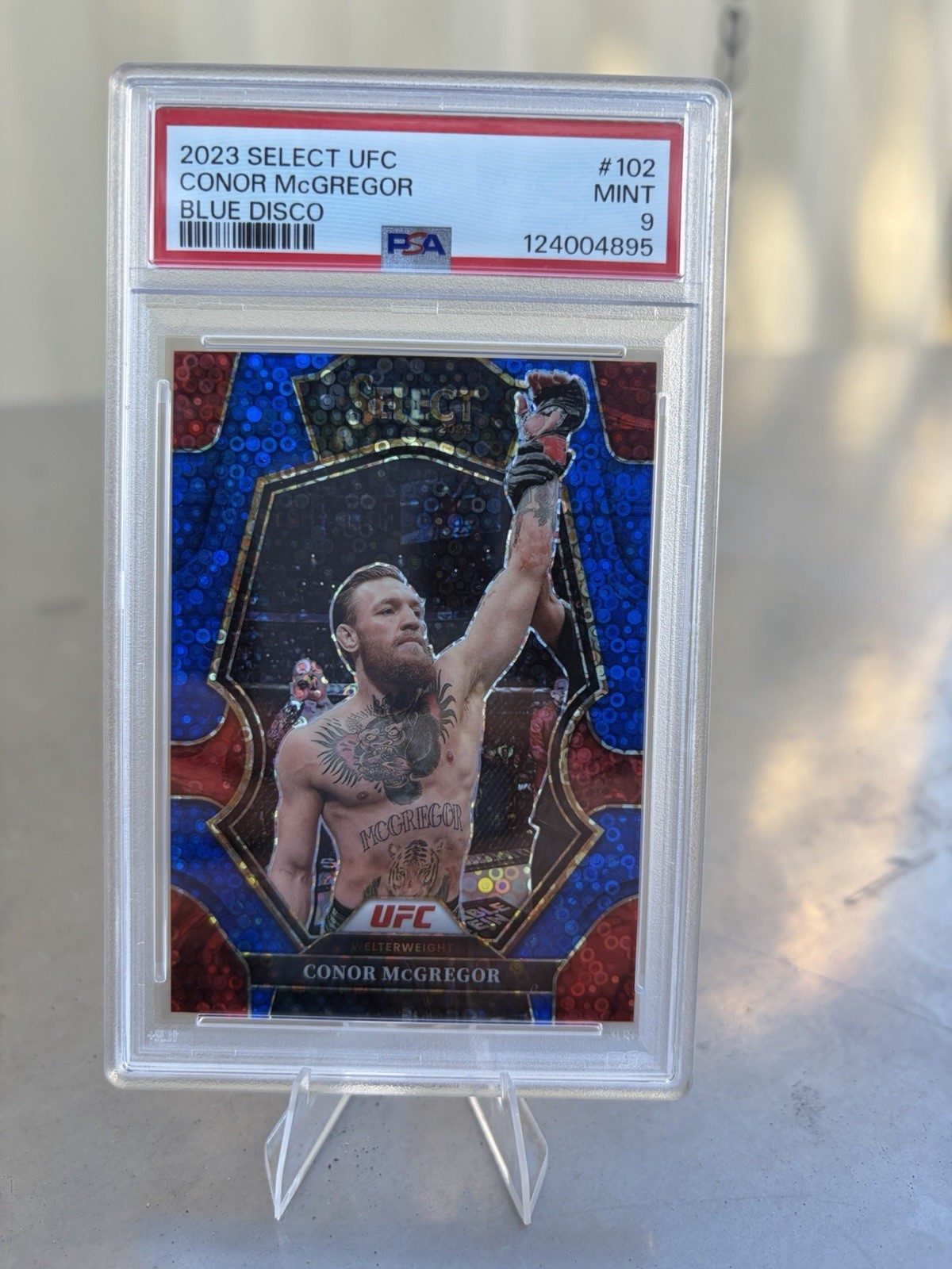 Panini 2023 Select UFC Premier Level Conor McGregor #102 Blue Disco /49 PSA 9