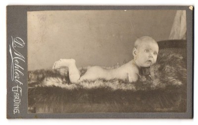 Photograph D. Mehlert, Garding, sweet toddler lying on fur 