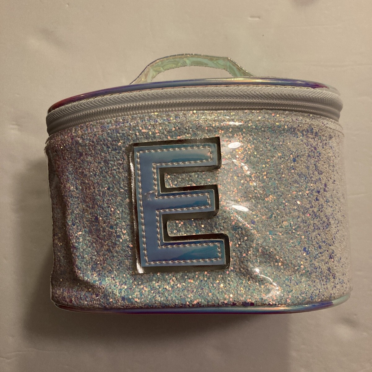 Cosmetic bag with initial sale