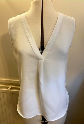 white plunge neck top
