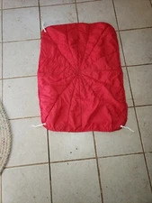 English unbranded homemade saddle pad used Red on one side plaid on the other.  