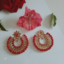 Beautiful statement earrings with beadscrystal-style stones. chandelier design