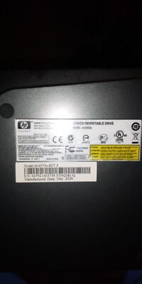 HP dvd/cd external rewritable drive. Model dvd555s-H07 3, manufactured May 2009.