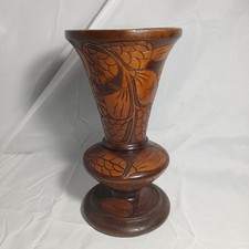 Vintage Large hand-carved wooden vase, often associated with folk art styles.