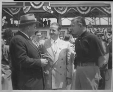 Clark Gable converses with Benson Ford and Seth Klein next to t 1950 Indy Photo