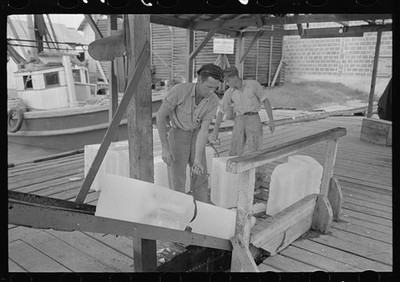 Chopping ice before shaving,icing shrimp boat,Morgan City,Louisiana,LA,FSA,2