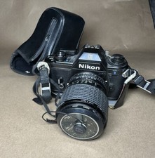 nikon em 35 film camera with promaster Spectrum 7 1A 52MM lens untested