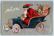 Christmas Santa Claus With Toys Driving Car Embossed Slingeland NY Postcard